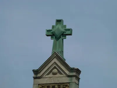 Cross atop church.