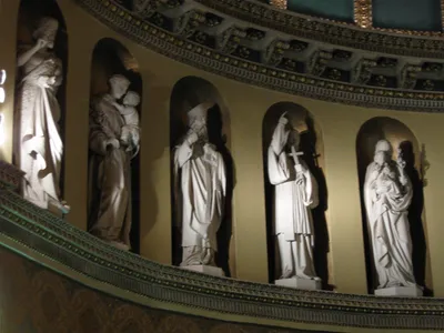 Statues along santuary wall.