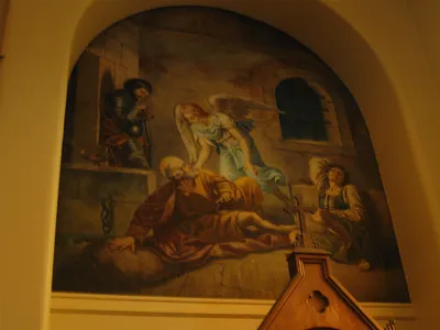 Painting on left side of St. Paul in prison.