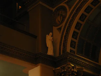 Angel next to choir loft.