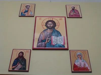 Icon of Christ, the two patron saints of this church, and two of the closed eastide churches in Elmira.