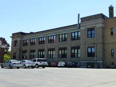 School seen from church parking lot.