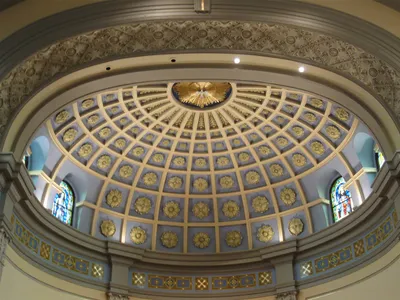 Intricate designs on ceiling above sanctuary.