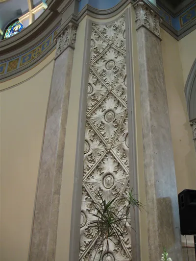 Engravings along sanctuary wall.