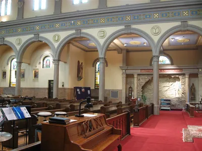 Left side of the church.