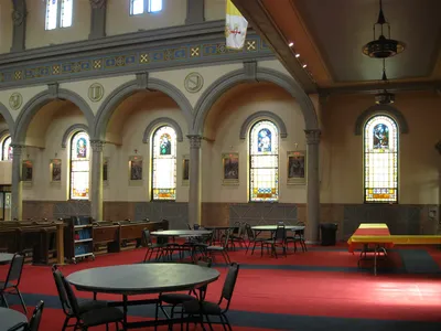 Back right corner of the church.
