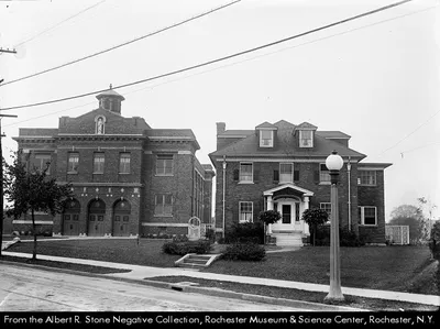 Exterior of former church and rectory. Later used as the parish school. Source: Albert R. Stone negative collection