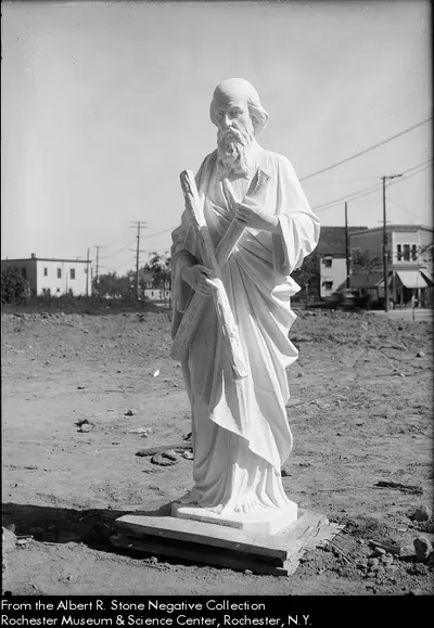 Statue of St. Andrew before being located above the entrance of the former church. Source: Albert R. Stone negative collection