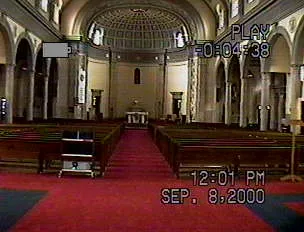 Interior of church prior to rennovation. Note the absence of sanctuary crucifix and the central location of the tabernacle. There is no gathering area in the back of the church in this photograph. 2000. Source: Diocese of Rochester News and Views