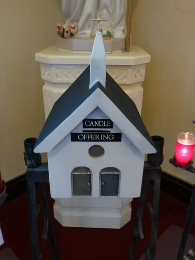 Place to put candle offerings.