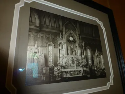 Very old photograph of interior. The high altar used to be along the very back of the church. Today, the front of the church has been moved forward. There's a hallway and sacristy behind the modern front.