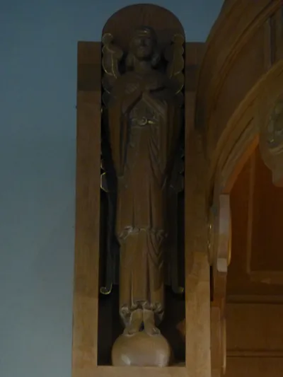 Angel statue in reredo.