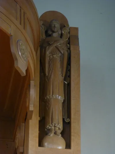 Angel statue in reredo.