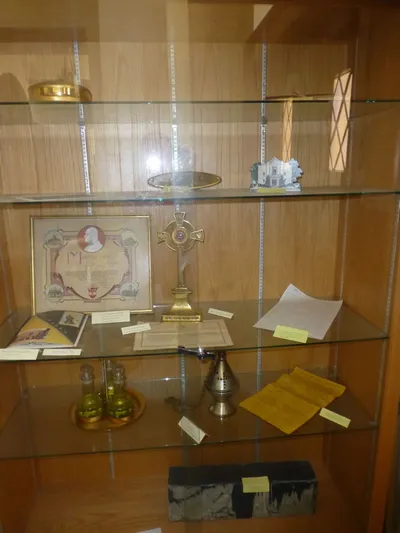 Display case at St. Casimir with items from the former St. Anthony's.