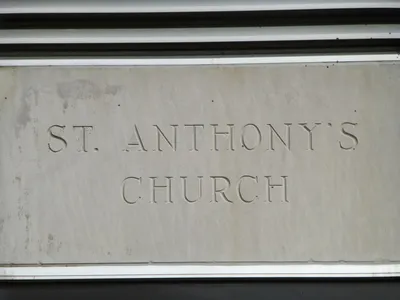 Cement inscription on church front.