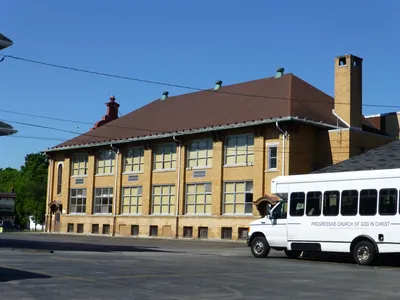 Former school seen from back right corner parking lot.