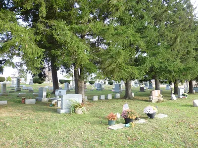 Modern cemetery located across the road and down a few lots from the church building.