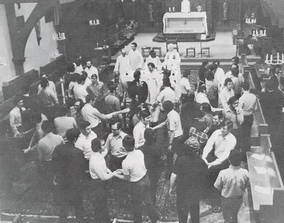 Exchange of the kiss of peace in the chapel, 1967. View of the remodeled sanctuary. Source: St. Bernard's Seminary: 1893-1968