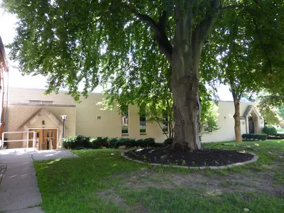 Left side of the church.