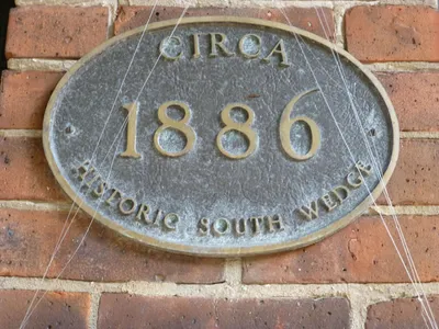 Historic site marker on the rectory.