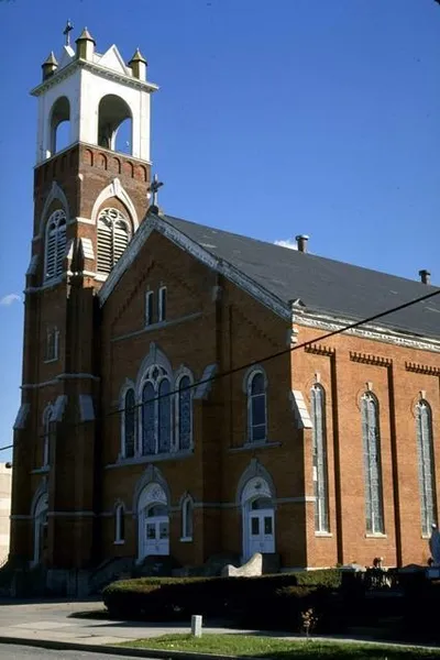 Exterior of church, 1970s?. Note statue of Our Lady to the right of the church building. Source: Rochester City Hall photo lab