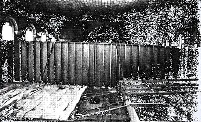 The poor state of St. Bridget's church building can be seen in this Democrat and Chronicle photograph prior to the final Mass in the building. A divider wall was erected because the back of the church was completely unusable and the parish could not afford repair. Source: Democrat and Chronicle
