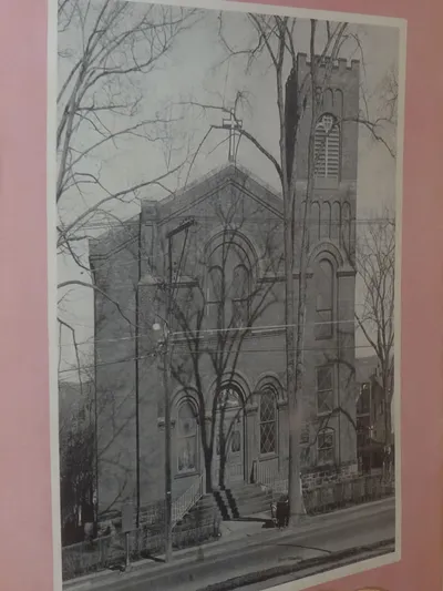 Old photograph of church in the display cabinet at Ss. Peter and Paul.
