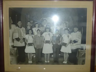 Old photograph of the sanctuary in the display cabinet at Ss. Peter and Paul.
