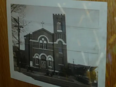 Old photograph of church in the display cabinet at Ss. Peter and Paul.