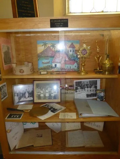 Display cabinet at Ss. Peter and Paul with historical items from St. Cecilia.