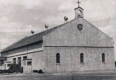 Exterior of former church, 1939. Note the much different facade compared to the present day appearance of the building. Source: Catholic Courier Golden Jubilee Edition: 1889-1939