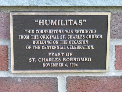 Memorial plaque recognizing the retrieval of the cornerstone from the former church, which was sold and no longer exists.