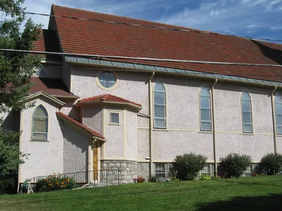 Left side of the church.
