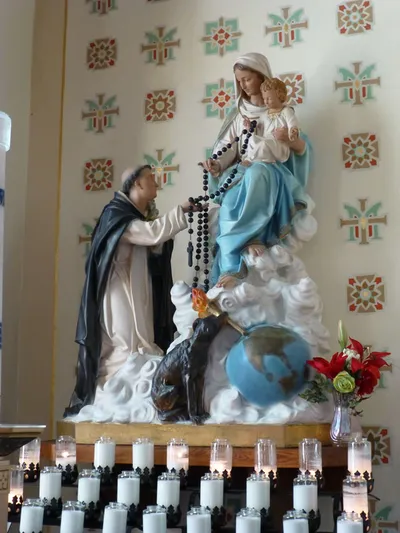 Statue of St. Dominic receiving the rosary.