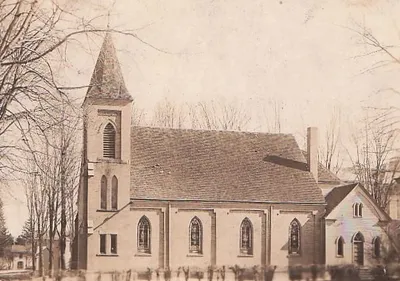 Old photograph of the right side of St. Dominic. Note the difference to the back right entrance. It also appears to be sided, instead of brick.