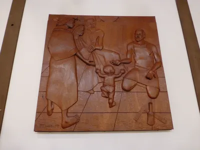 Wood-carved relief.