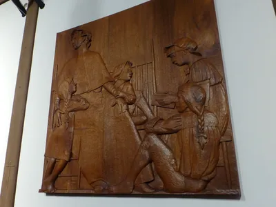 Wood-carved relief.