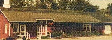 Older photograph of the original church building. There appears to be a steeple on the left side of the church. Source: St. Elizabeth Ann Seton Web site