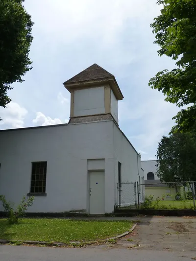 Back corner of the church. Bell appears to have been removed from tower.
