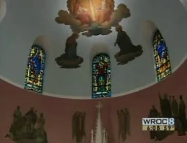Paintings and stained glass windows on the ceiling of the sanctuary. Source: WROC news coverage of final Mass