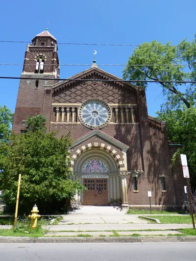 Front of the mosque. Relief above front door replaced, and crosses replaced on center and bell tower.