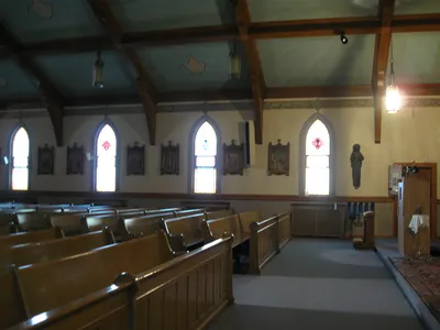 Left side of the church.