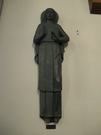 Wall-mounted statue.s
