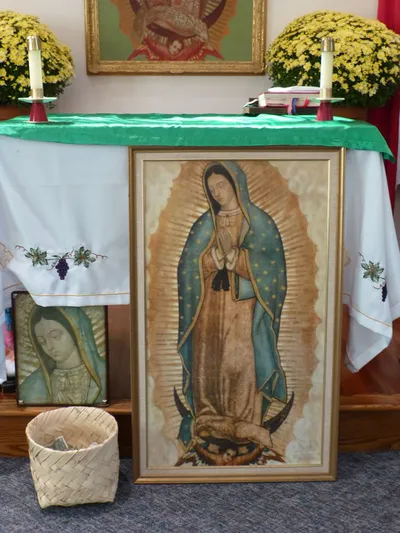 Our Lady of Guadalupe paintings, and altar.