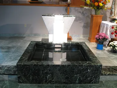 Baptismal font, located to the left of the altar.