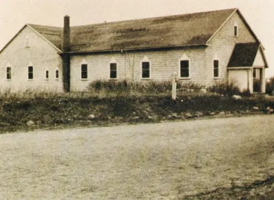 Old photograph of original church. Probably taken in the early 1930s. 1980 parish directory.