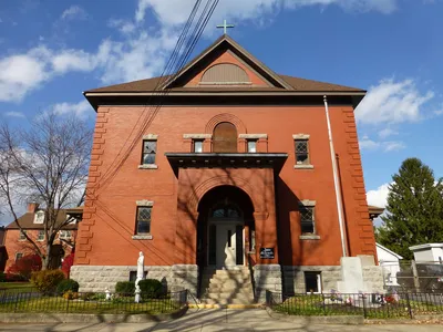 Exterior of the former church/school building, now a parish center.