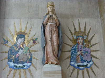Statue of Our Lady and two images.