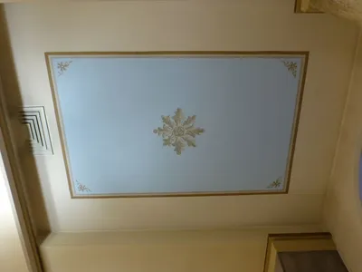 One of the paintings on the ceiling along the side aisles.