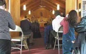 Small photo of interior during final Mass. Source: AuburnPub.com